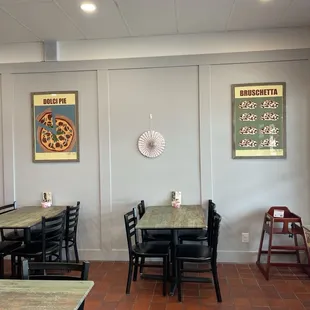 a dining area with tables and chairs