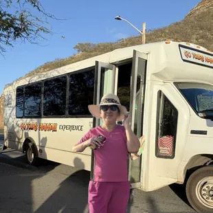 Posing with tour bus