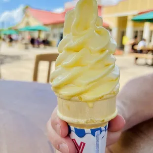 Dole soft serve on a cone.