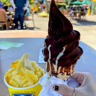 Dole whip with pineapples and Dole whip dipped in chocolate on a cone.