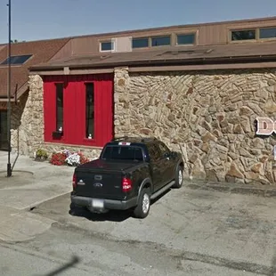 a car parked in front of it