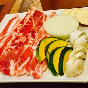 a plate of meat and vegetables