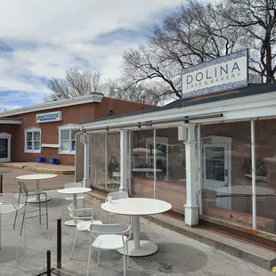 Store front. Relax, have a coffee. It&apos;ll be a short wait (10-15min)