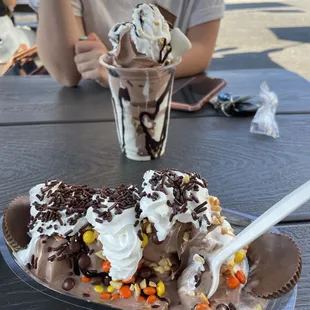 a chocolate ice cream sundae with candy and sprinkles
