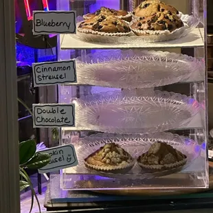 a display of muffins and other pastries