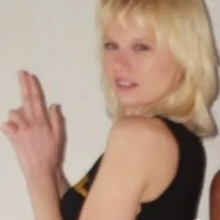 a woman in a black dress and a man in a black shirt