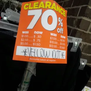 a clearance sign for a clothing store