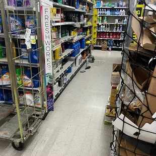 Spill at end of aisle with trash