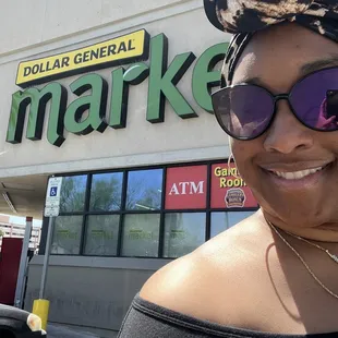 a woman wearing sunglasses and a head scarf