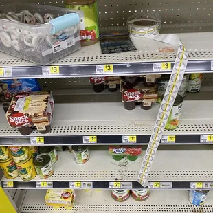 a shelf of food items in a grocery store