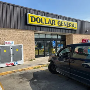 a car parked in front of a dollar general store