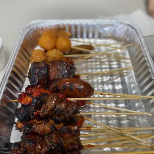 a tray of skewered food