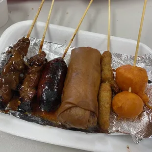 Pork bbq, longanisa, veggie egg roll, fish cake and kwek-kwek (battered quail egg)