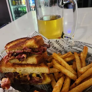Pastrami sandwich with fries and 28-degree beer