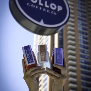 two hands holding a sign