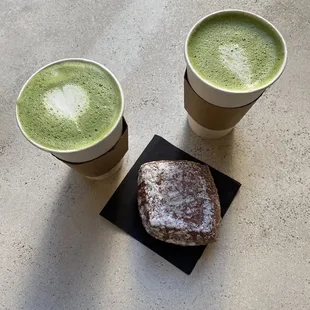 two cups of green tea and a sandwich