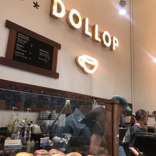 a woman working behind the counter