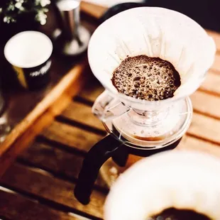 coffee being poured into a coffee pot