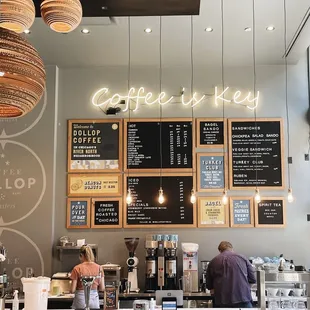 a coffee shop with menus on the wall