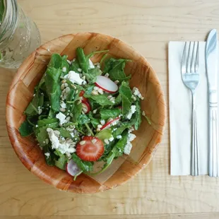 Kale, farro, radish, strawberries, goat cheese, sunflower seeds.