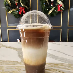 a cold beverage in a plastic cup