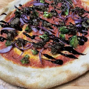 The collisseum - our seasonal (vegan) red onion, broccoli, lemongrass impossible beef, balsamic