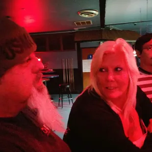 a man and a woman sitting at a bar