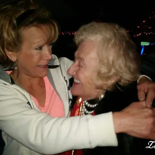 two women embracing each other