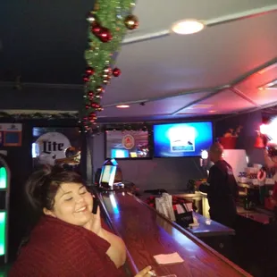a woman sitting at the bar