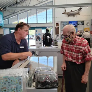 Rich D. helping my dad at the display case