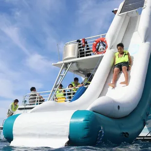 Slide down the Dolphins and You 20-foot waterslide into the ocean!