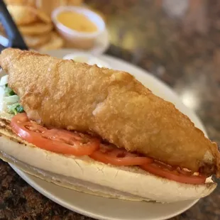 a fish sandwich and chips