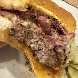 Bite out of the yummy strain burger with light sauerkraut