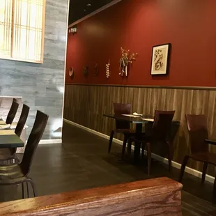 a dining area with tables and chairs