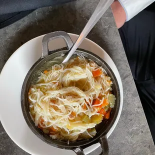 a bowl of noodles and vegetables