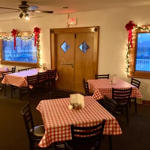 a dining room decorated for christmas