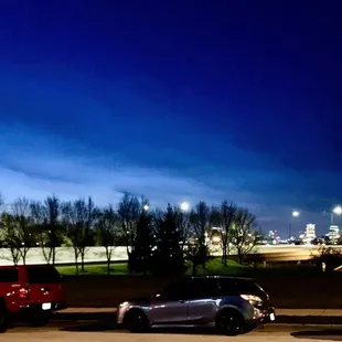 cars parked in a parking lot at night