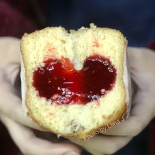 Inside of Strawberry-Filled Donut - strawberry jam is completely smooth/goopy, on the sweet side