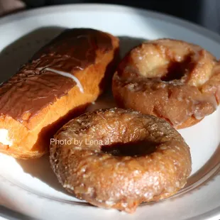 Custard, sour cream, and pumpkin glazed donuts