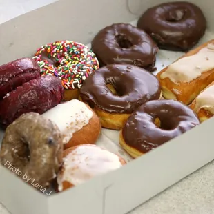 Assorted donuts ($16/dozen): red velvet, blueberry cake, apple-filled, chocolate-glazed, chocolate-glazed chocolate, maple cream bar