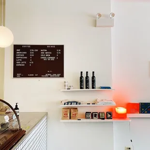 a counter with a menu on the wall