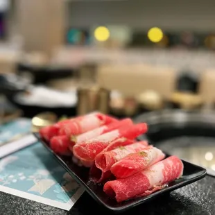 a plate of sushi rolls