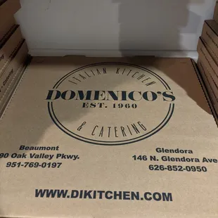 a pizza box on the floor