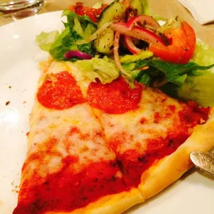 a slice of pizza and salad