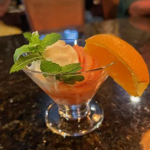 an orange slice and ice cream