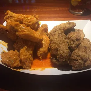 The breaded wings. Spicy garlic on left. Cajun dry rub on right.