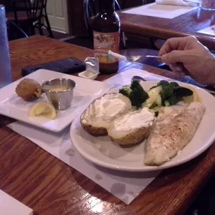 Grilled Walleye and my husband waiting anxiously to "dig in".