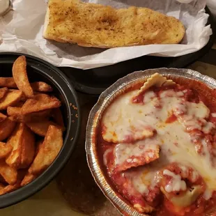 Beef Ravioli, garlic bread and potato wedges.