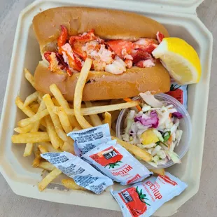 lobster roll served with pineapple slaw