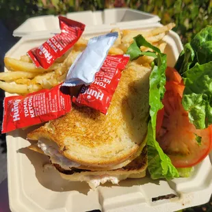 grilled fresh crab and shrimp sandwich: real crab and shrimp mixed with light mayo on sliced sourdough bread, served with garlic fries
